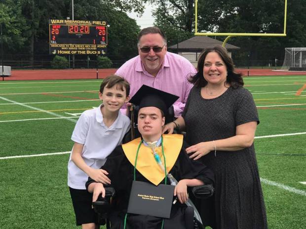 Corey and family on graduation day.